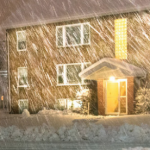 house in sleet and snow